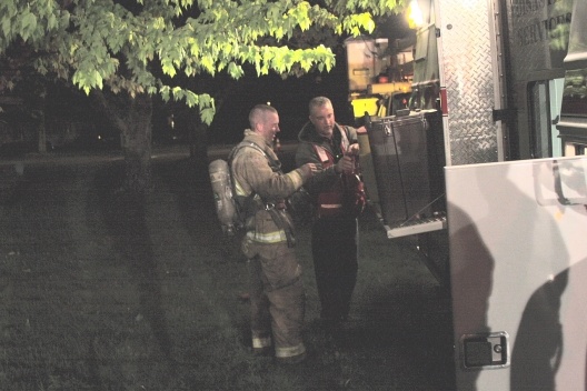 Snapshot of firefighters using the beverage station on the old Red Cross ERV.